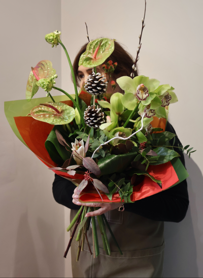 Orchid Delight by Octagon Flowers, Bolton - Make a statement this season with this stunning luxury winter bouquet, beautifully arranged by Fiona at Octagon Flowers in Bolton. Featuring striking green cymbidium orchids, elegant anthuriums, festive pinecones and rich seasonal foliage, this contemporary design is full of texture, style and winter charm.

Perfect for a special gift, festive celebrations, or as a show-stopping centrepiece, this bouquet offers something truly unique and memorable. Hand-crafted with care using premium stems for a modern and artistic finish.

A bold and beautiful choice for someone who loves something a little different.