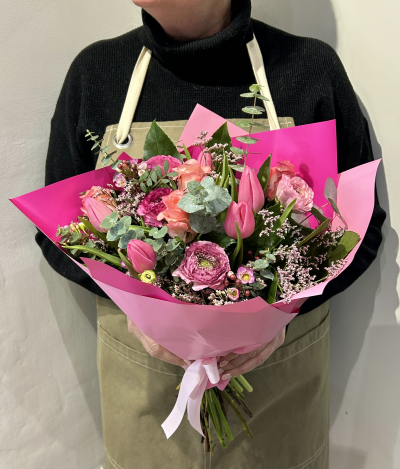 Spring Delight - A romantic hand-tied bouquet of pink tulips, ranunculus, roses, wax flowers and eucalyptus. Perfect for birthdays, thank-yous or just because.