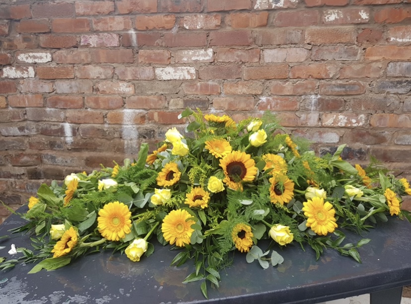 Yellow sun flower mix casket spray