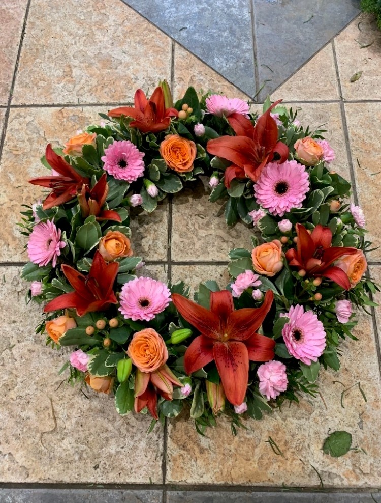 Open pink orange and red open Wreath
