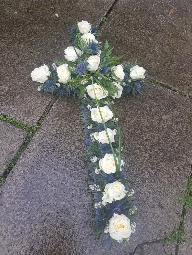 Cross Blue thistle and white roses